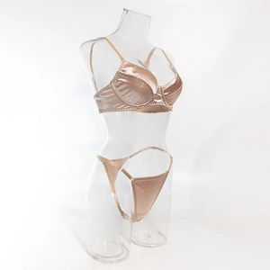 Detail of champagne satin lingerie set with smooth finish and adjustable thin straps