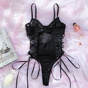 Detail of sexy black mesh bodysuit with white daisy embroidery and adjustable side ties