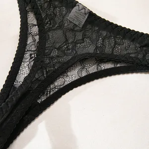 Detail shot of black floral eyelash lace panties with intricate embroidery patterns