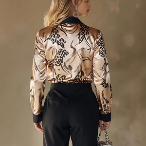 Back view of a satin printed long sleeve shirt for women in golden bronze with black collar