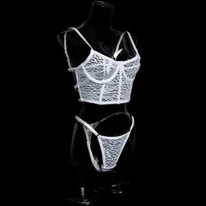 Detail of white lace lingerie set with leopard pattern and sheer mesh structure