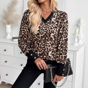 Women's V-neck leopard print long sleeve top with gold button cuffs and black trim