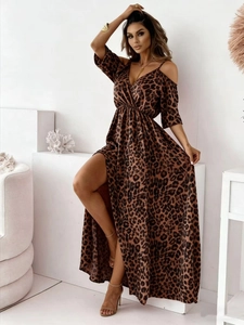 Detail of leopard print dress with cold shoulder design and high slit leg opening