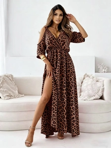 Detail view of the elegant deep V-neckline and shoulder cut-out on leopard print maxi dress