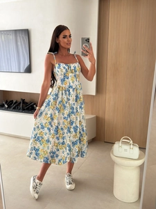 Detail of floral and lemon print summer dress with bow straps and pleated waist