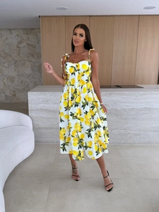 Detail of lemon print midi dress with sweetheart neckline and bow tie straps