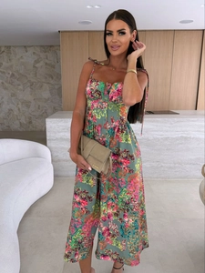 Close-up of floral print dress featuring front buttons and tie-up ribbon shoulder straps