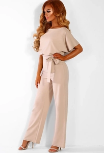 Elegant beige short sleeve wide leg jumpsuit with waist belt and cape-style sleeves