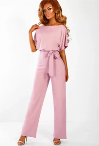 Full studio shot of a chic dusty rose short sleeve jumpsuit with a belted waist detail
