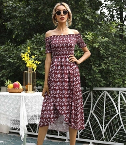 Detail of floral off-shoulder summer dress with smocked bodice and high-low hemline