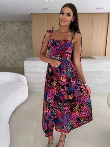 Detail of floral summer dress with adjustable bow straps and heart-shaped neckline