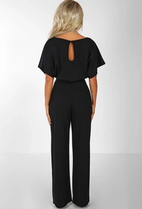 Detail of elegant black jumpsuit featuring a keyhole back design and button closure