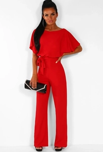 Detail of red wide-leg jumpsuit with waist tie and batwing sleeves for women