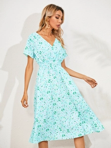 Detail of light blue floral short sleeve dress with V-neck and elastic waist design