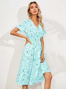 Detail shot of the V-neck and short sleeves on a floral light blue summer midi dress