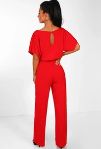 Back view of red high-waist jumpsuit featuring teardrop cutout and button closure detail