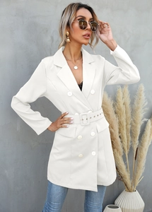 Detail of white double-breasted coat with matching fabric buttons and a wide waist belt
