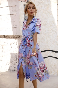 Detail of floral printed summer dress with waist tie and button-down shirt collar design