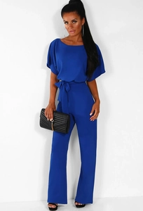 Detail of royal blue short sleeve jumpsuit with waist tie and elegant wide leg trousers
