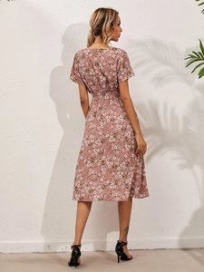 Back view of summer floral midi dress with elastic waist and delicate flower print