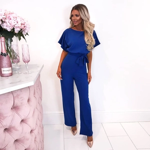 Detail of royal blue short sleeve jumpsuit with waist tie and wide leg silhouette