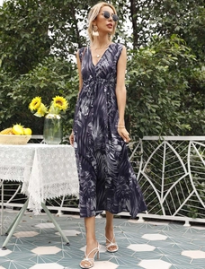 Detail of a V-neck sleeveless dress with tropical palm print and adjustable drawstring waist