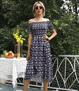Detail of smocked bodice and floral pattern on a navy off-the-shoulder high-low dress