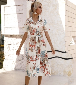 Detail of summer short sleeve shirt dress with vintage floral print and belted waist