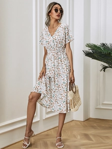 Detail of summer V-neck floral midi dress with tie waist and delicate small prints