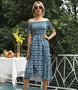 Detail of smocked bodice and floral pattern on off-shoulder summer dress with ruffles