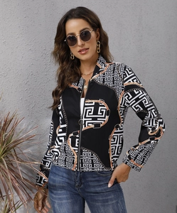 Detail of women's zip-up jacket featuring retro geometric patterns and chain print