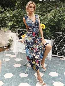 Detail of tropical floral print maxi dress featuring a deep V-neck and sleeveless cut