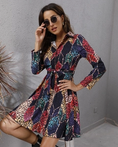 Detail of colorful leopard print shirt dress with long sleeves and belted waist ties