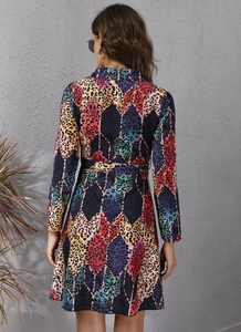 Back view of colorful leopard print long sleeve dress with waist belt and collar