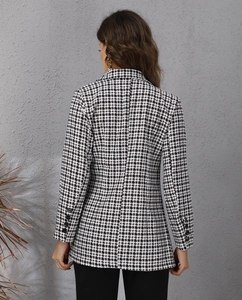Detail view showing the slim fit back tailoring of the houndstooth blazer jacket
