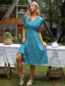 Close-up of lightweight floral summer dress featuring V-neck and elastic high waist
