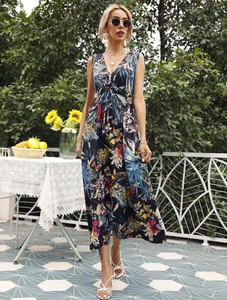 Detail of a tropical floral print maxi dress with deep V-neck and drawstring waist