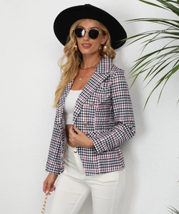 Close-up of women's gingham blazer featuring classic lapels and metallic double-breasted buttons