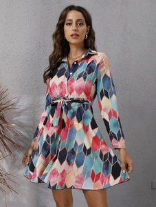 Close-up of geometric diamond print dress with button-down front and waist tie belt