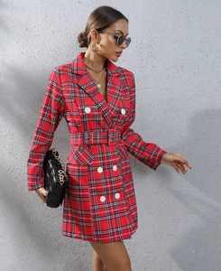 Detail of red houndstooth blazer dress with double-breasted buttons and matching waist belt