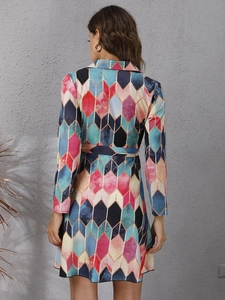 Rear view of long sleeve mini dress featuring colorful geometric diamond patterns and waist belt