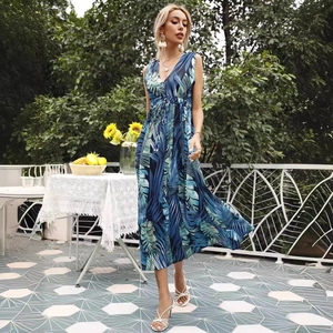 Elegant sleeveless V-neck maxi dress with blue tropical leaf print and waist drawstring
