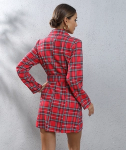 Detail of red houndstooth blazer dress with waist belt and long sleeves for women