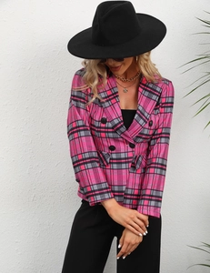 Detail of a pink and grey plaid blazer with double-breasted black buttons and lapel collar