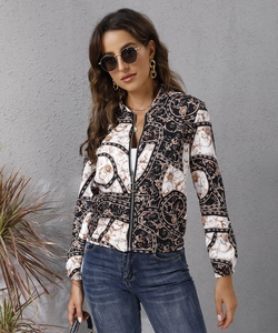 Detailed view of the vintage Baroque print and silver ring zipper on women's jacket