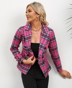 Close-up of women's pink plaid blazer featuring a notched lapel and double-breasted buttons