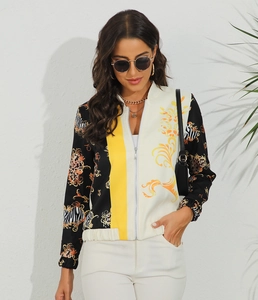 Detail shot of a zipper jacket featuring baroque gold patterns and leopard print panels