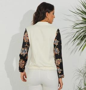 Rear view of a white jacket featuring baroque animal print sleeves and zip-up detail