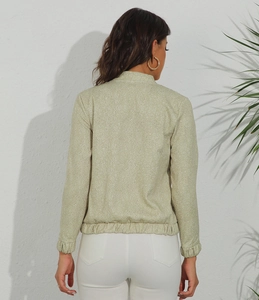 Rear view of light green slim-fit women's jacket with white floral print and stand collar