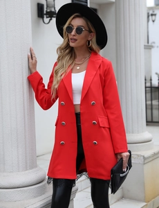 Detail of red double-breasted blazer with metallic buttons and black lace hem trim